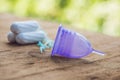 Different types of feminine hygiene products - menstrual cup and Royalty Free Stock Photo