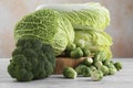 Different types of fresh cabbage on white wooden table Royalty Free Stock Photo