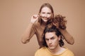 Different types of hair concept. Happy couple in love studio photo. Handsome man with long wavy hair and his cute