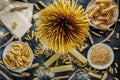 Different types of Italian pasta on a dark wooden rustic background. Mixed dry pasta and spaghetti. Still life. Rustic style. Top Royalty Free Stock Photo