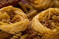 Different types of italian pasta. Spaghetti, tagliatelle, fusilli, pappardelle, fettuccine. Various uncooked pasta set made from Royalty Free Stock Photo