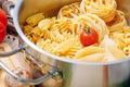 Different types of italian pasta on a wooden background with various ingredients for cooking traditional italian dishes Royalty Free Stock Photo