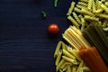 Different types of Italian pasta on a wooden table with copy space Royalty Free Stock Photo