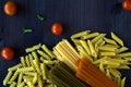 Different types of Italian pasta on a wooden table with copy space Royalty Free Stock Photo