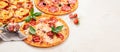 Different types of italian pizza on light background Royalty Free Stock Photo