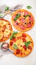 Different types of italian pizza on light background Royalty Free Stock Photo