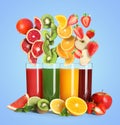 Different types of juices and fresh fruits on light blue Royalty Free Stock Photo