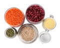 Different types of legumes and cereals on background, top view. Organic grains Royalty Free Stock Photo