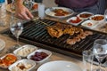 Different types of meat grilled on Barbecue on the table, Served with special Turkish appetizers and Turkish raki Royalty Free Stock Photo