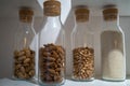 Different types of nuts in glass jars Royalty Free Stock Photo