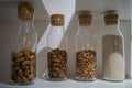 Different types of nuts in glass jars Royalty Free Stock Photo