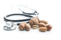 Different types of nuts in the nutshell and stethoscope.