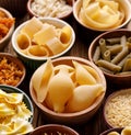 Different types of pasta in a bowls on a wooden background Royalty Free Stock Photo