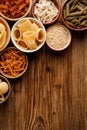 Different types of pasta in a bowls on a wooden background Royalty Free Stock Photo