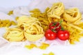 Pastas and cherry tomatoes on cloch
