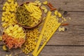 Different types of pasta in ceramic bowls. Traditional Italian food, healthy eating concept. Rustic wooden table Royalty Free Stock Photo