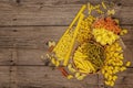 Different types of pasta in ceramic bowls. Traditional Italian food, healthy eating concept. Rustic wooden table Royalty Free Stock Photo