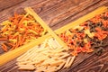 Different types of pasta separated frame of spaghetti lying on r