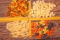 Different types of pasta separated frame of spaghetti lying on r