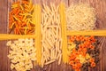 Different types of pasta separated frame of spaghetti lying on r