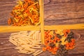 Different types of pasta separated frame of spaghetti lying on r