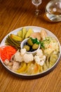 Different types of pickled vegetables on a white plate Royalty Free Stock Photo