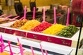 Different types of preserved cherries in a shop