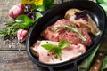 Different types of raw Fresh Meat, chicken fillet, pork and beef in a cast-iron grill pan Royalty Free Stock Photo