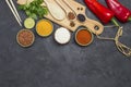 Different types of rice and spices. Wooden cutting board. Raw Red Pepper