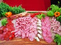 Different types of salami slices and bacon