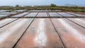 Different types of salt in salt pans with salt harvesting pools Royalty Free Stock Photo