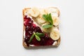 Different types of sandwiches for healthy and sugar-free children`s breakfast, with berry jam, bananas