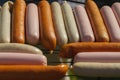 Different types of sausages on the grill board are prepared for frying Royalty Free Stock Photo