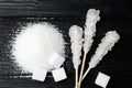 Different types of sugar on black wooden table Royalty Free Stock Photo