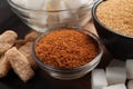 Different types of sugar on wooden table, closeup Royalty Free Stock Photo