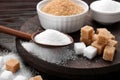 Different types of sugar on wooden table, closeup Royalty Free Stock Photo