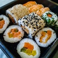 Different types of sushi on a black tray. Royalty Free Stock Photo