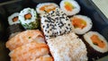 Different types of sushi on a black tray. Royalty Free Stock Photo