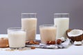 Different types of vegetable milk on the table.