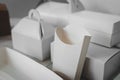 Different types of white cardboard packaging. For fast food, folding, large and small. The concept of production and design of