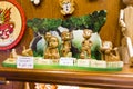 Different types of wood puppets exposed in a souvenir shop