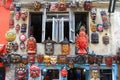Different types of wooden mask hanging on external wall in Kathmandu, Nepal