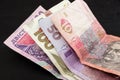 Different Ukrainian hryvnias on a black background. Royalty Free Stock Photo