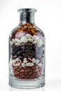 Different varieties of beans in glass bottle Royalty Free Stock Photo