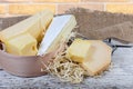 Different varieties of cheese on the old wooden surface Royalty Free Stock Photo