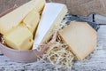 Different varieties of cheese on the old wooden surface Royalty Free Stock Photo