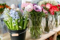 Different varieties. Fresh spring flowers in refrigerator for flowers in flower shop. Bouquets on shelf, florist Royalty Free Stock Photo