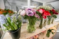 Fresh spring flowers in refrigerator for flowers in flower shop. Bouquets on shelf, florist business. Royalty Free Stock Photo