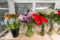 Fresh spring flowers in refrigerator for flowers in flower shop. Bouquets on shelf, florist business. Royalty Free Stock Photo