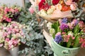 Different varieties. Fresh spring flowers in refrigerator for flowers in flower shop. Bouquets on shelf, florist Royalty Free Stock Photo